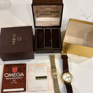 Omega gold watch.